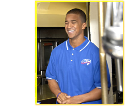 Smiling Person in Charge in a kitchen.