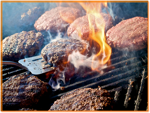 Cooking hamburgers.