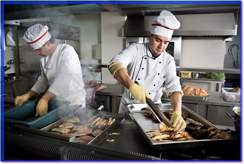 Two busy chefs in the kitchen.