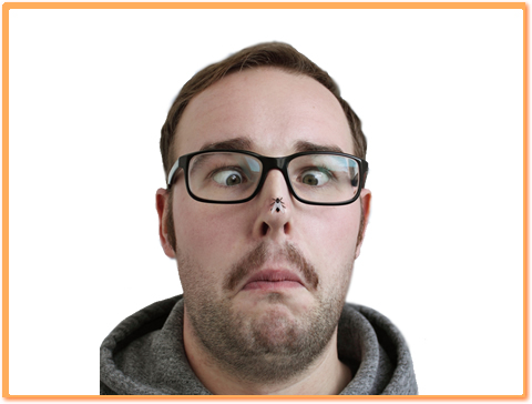 A cross-eyed person looking at a fly on his nose.