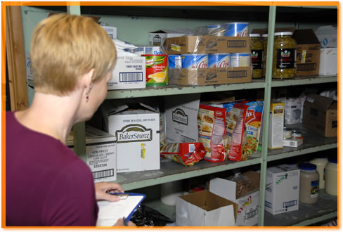 Health inspector looking around storage areas.