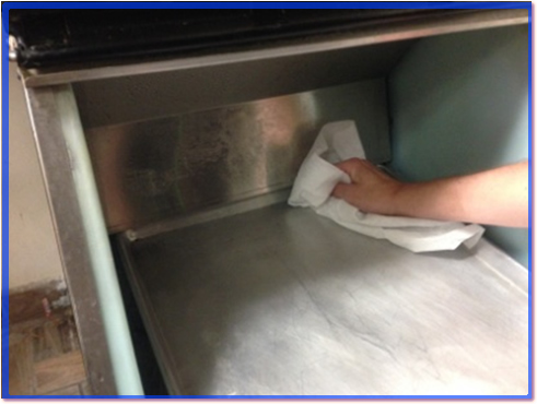 Cleaning ice machine deflector shield.