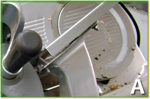Dirty meat slicer blade.