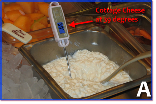 A digital thermometer in cottage cheese showing 39 degrees.