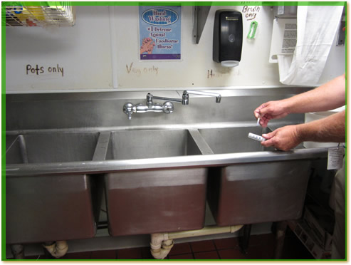 A three compartment sink.