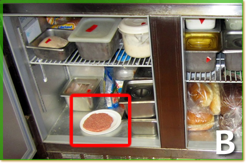 A raw hamburger patty on the bottem shelf of a fridge.